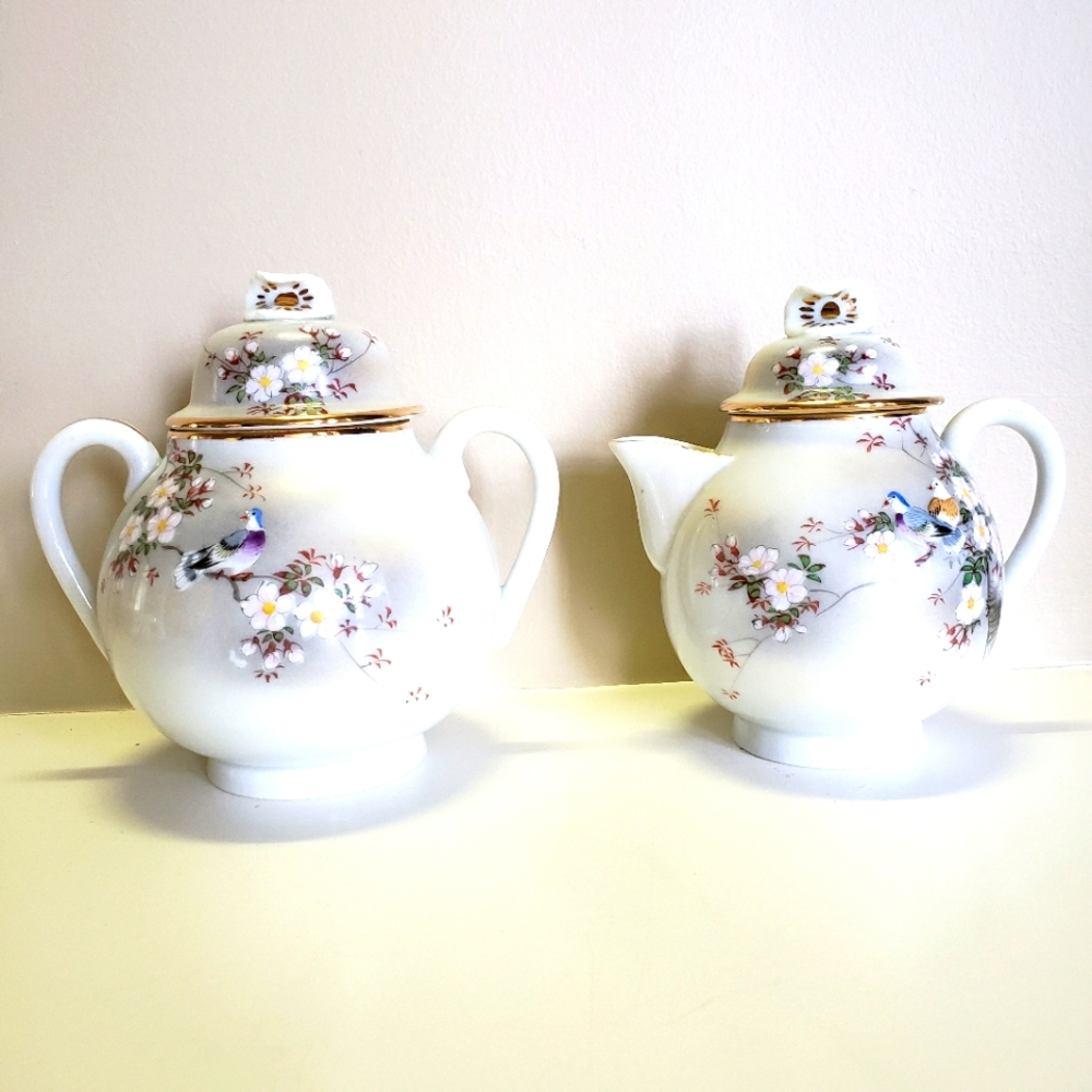 Japanese hand-painted porcelain creamer and sugar bowl set.